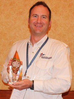 Brian Ligon with TAMI Award