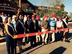 ribbon cutting in front of store