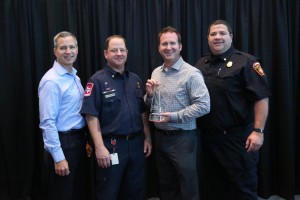 From left, Will Hampton, Lt. Pete Wagner, Brian Ligon, and Lt. Mike Heard accept a Municipal Excellence Award for communications.