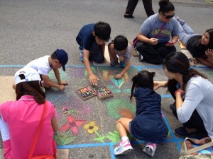 Chalk Walk features areas where attendees can create their own chalk art.