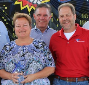 Patty Da Silva is recognized at Customer Service Week with Mayor Alan McGraw, middle, and Transportation Director Gary Hudder.