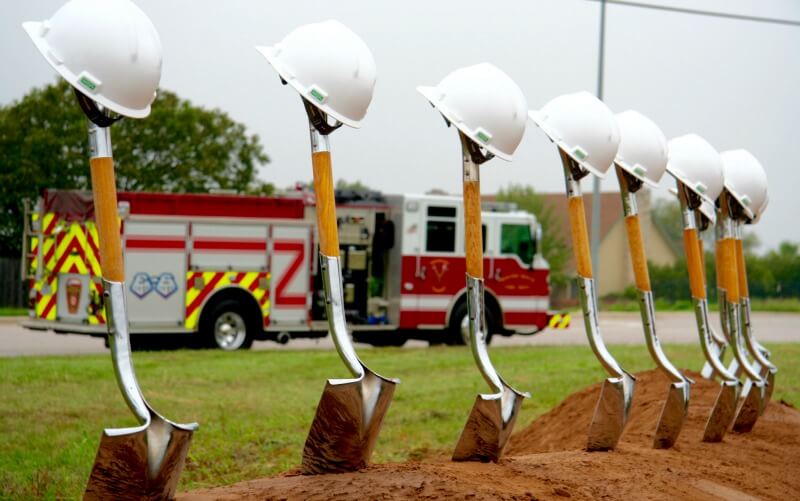 Eleven shovels stand at the ready for the groundbreaking event.