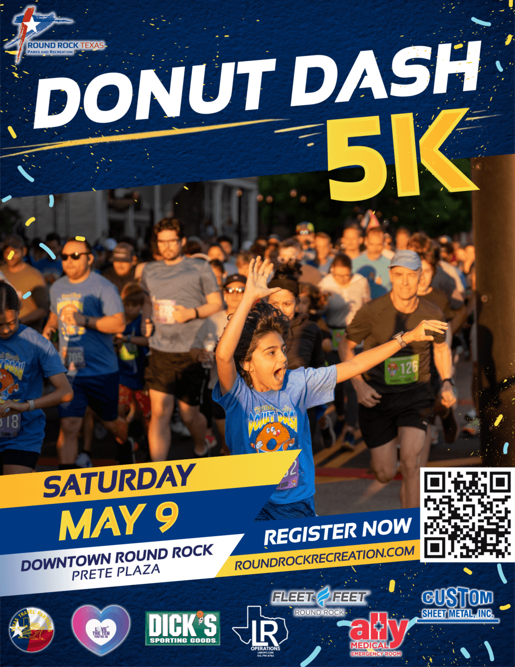 A group of runners, many wearing blue shirts and race bibs, start the Donut Dash 5K race. A girl in front holds up a donut. The event is on Saturday, May 9 at Downtown Round Rock, Prete Plaza.