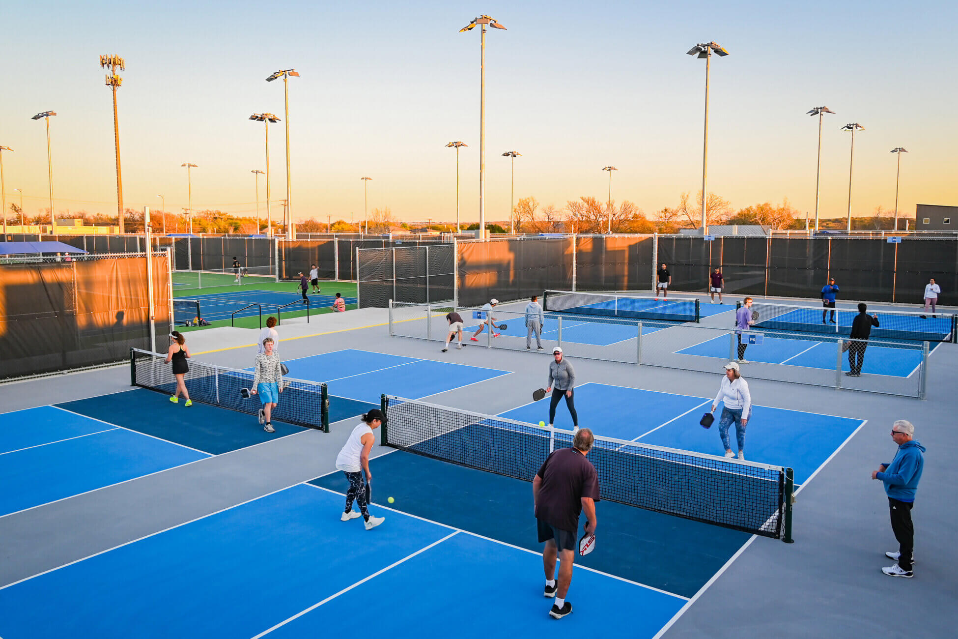 Tennis and pickleball players enjoy the newly completed courts at the Round Rock Parks and Recreation Adult Recreation Complex in March 2026.