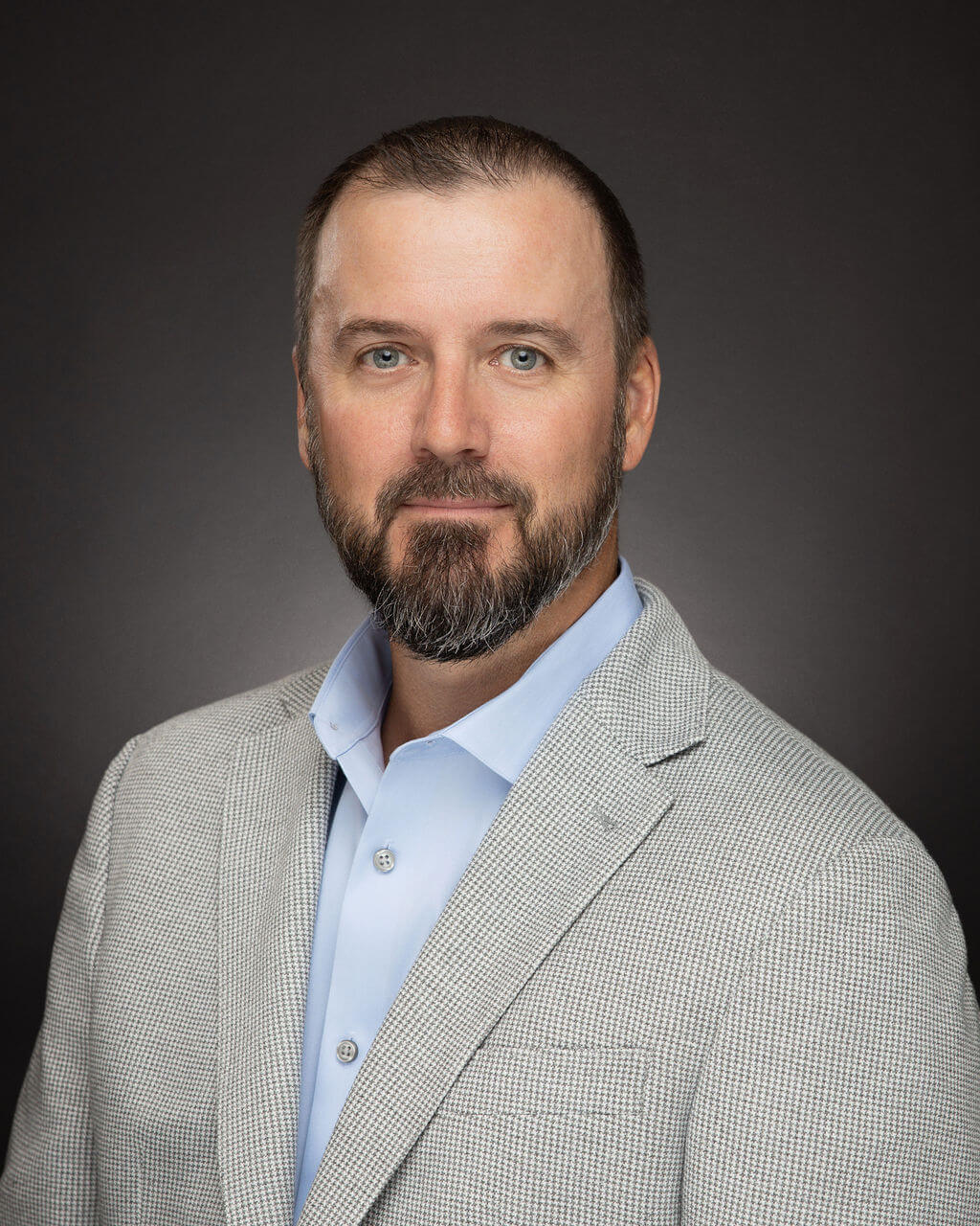 A headshot photo of Corey Amidon