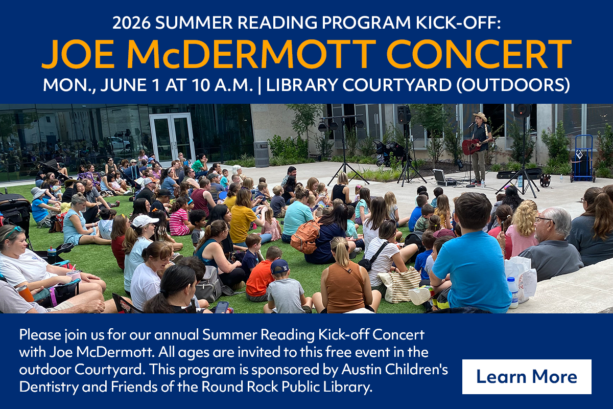 A crowd of adults and children sit on the grass in front of a musician performing outdoors at a library. The event is a summer reading kickoff concert by Joe McDermott, taking place on June 1, 2026.