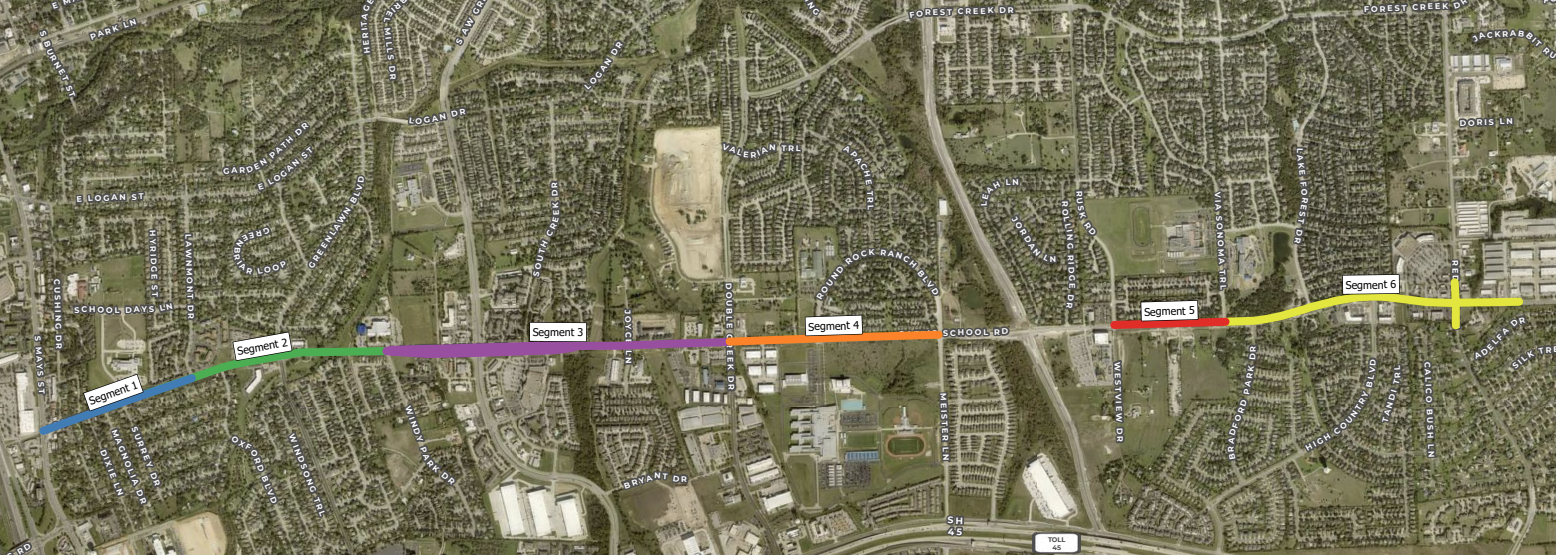 Aerial map showing a proposed route divided into six colored segments (blue, green, purple, orange, red, yellow) running west to east through a suburban area with roads, neighborhoods, and schools.