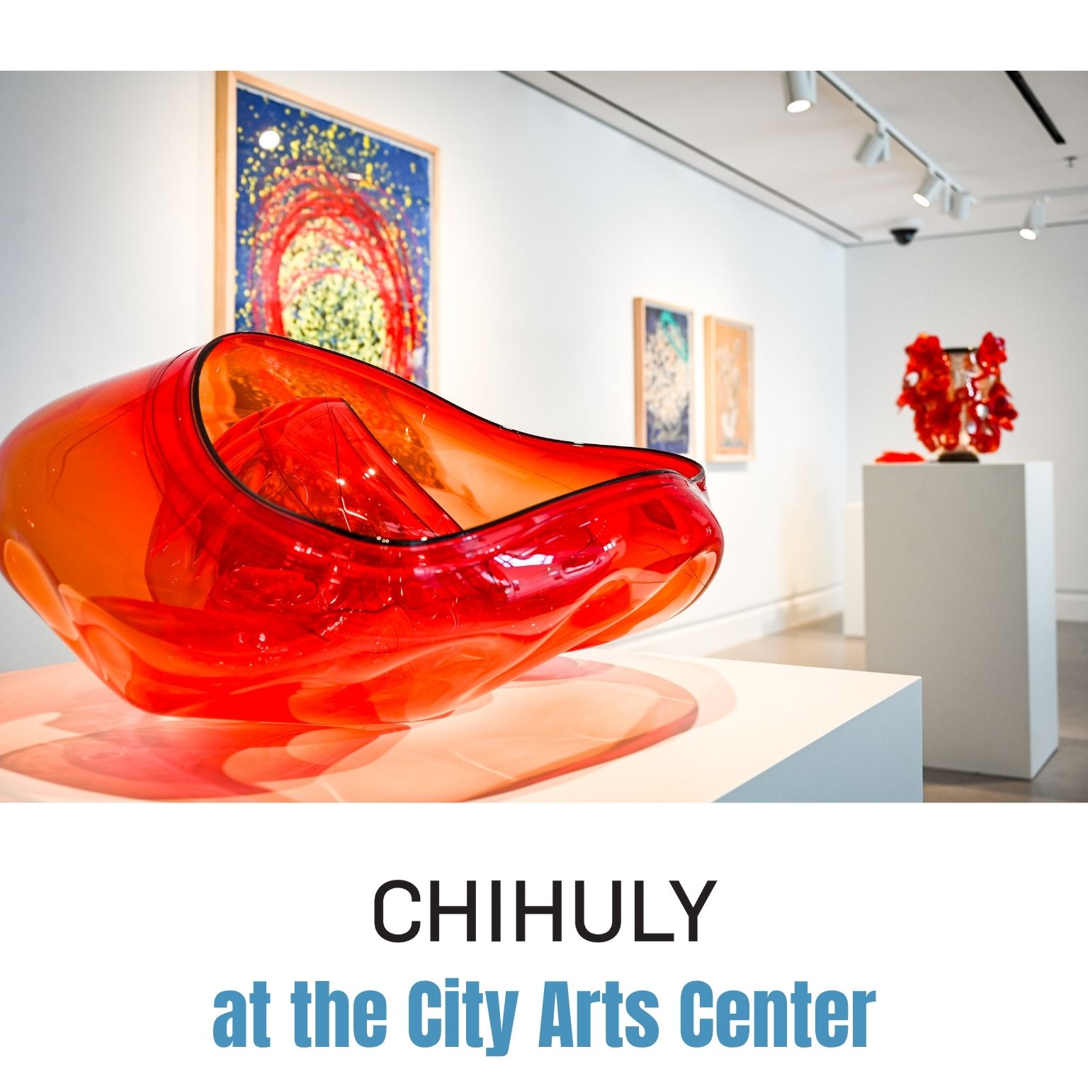 Bright red glass sculpture on a pedestal in a modern gallery, with colorful abstract paintings and more glass art in the background. Text reads: CHIHULY at the City Arts Center..