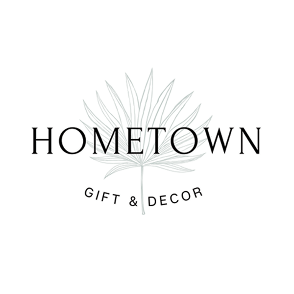 Logo with a simple leaf illustration behind the text HOMETOWN in large font and GIFT & DECOR in smaller curved text below it, all on a white background.