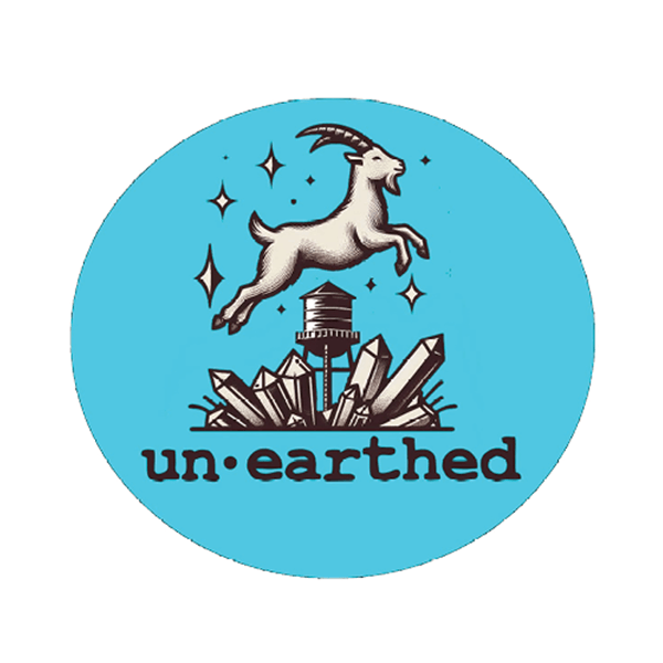 A goat leaps over a water tower surrounded by crystals, with the word un.earthed below, all set on a light blue circular background.